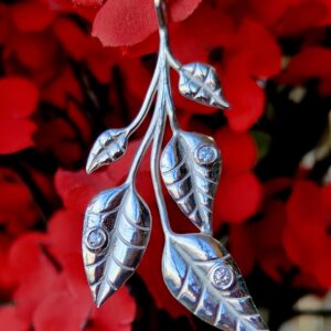 Silver tea leaf and diamond pendant