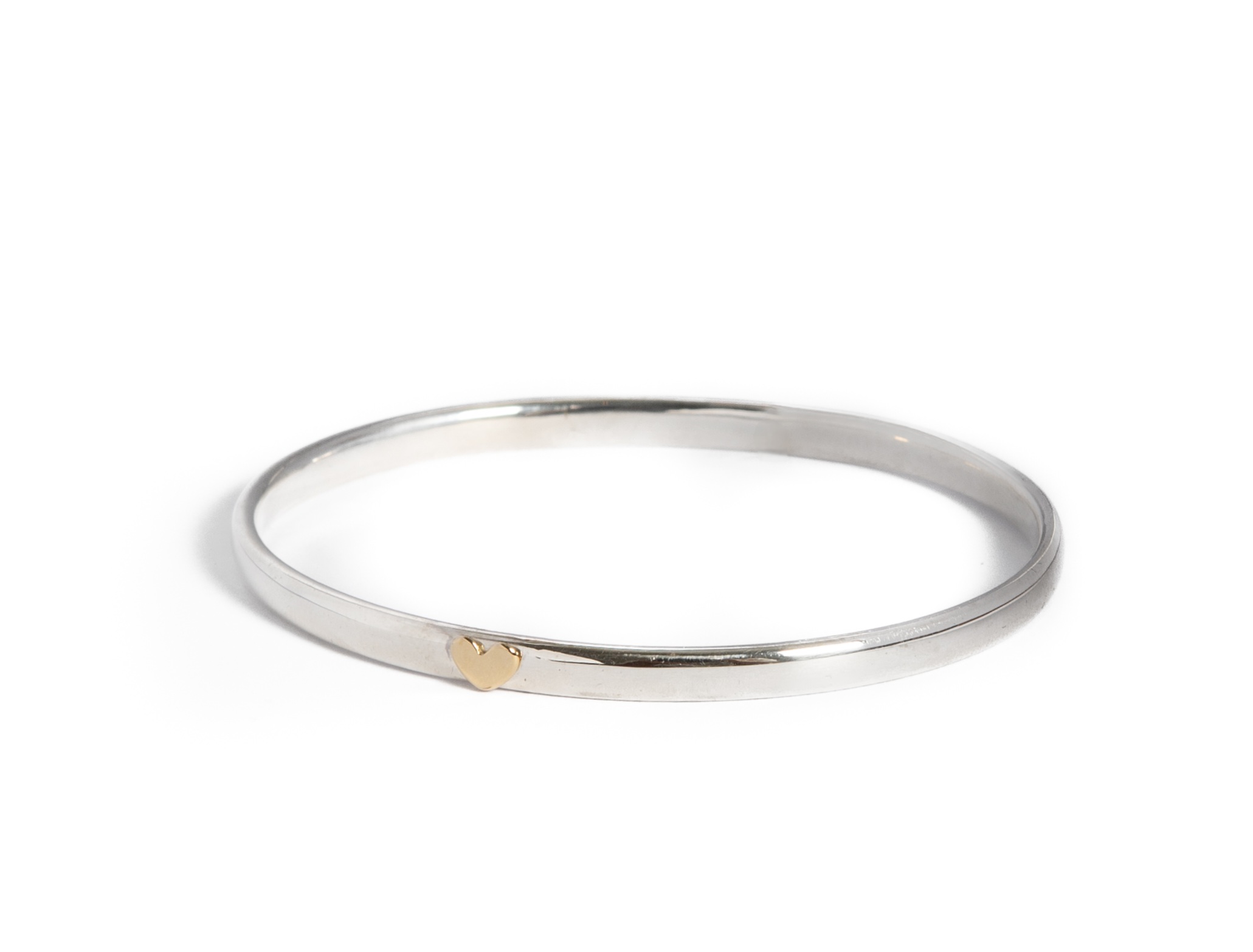 18ct gold heart on a silver bangle