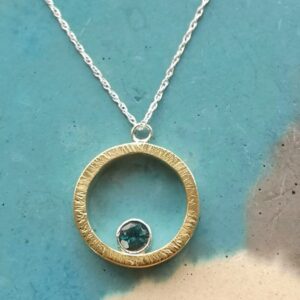 18ct gold and silver, London blue topaz pendant.