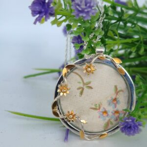 Silver and 24ct gold flower pendant