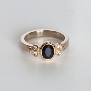 White and yellow gold, diamond and sapphire ring