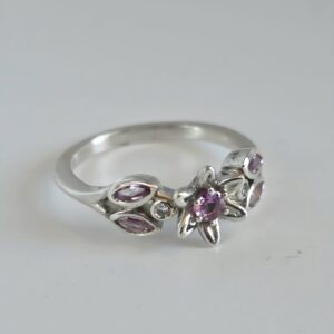 Pink sapphire and diamond, silver flower ring